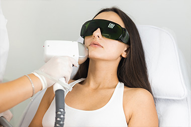 Female getting laser hair removal on her chin